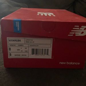 New Balance tennis shoes.